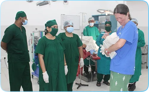 A new born baby in the OT, immediately after CS operation
